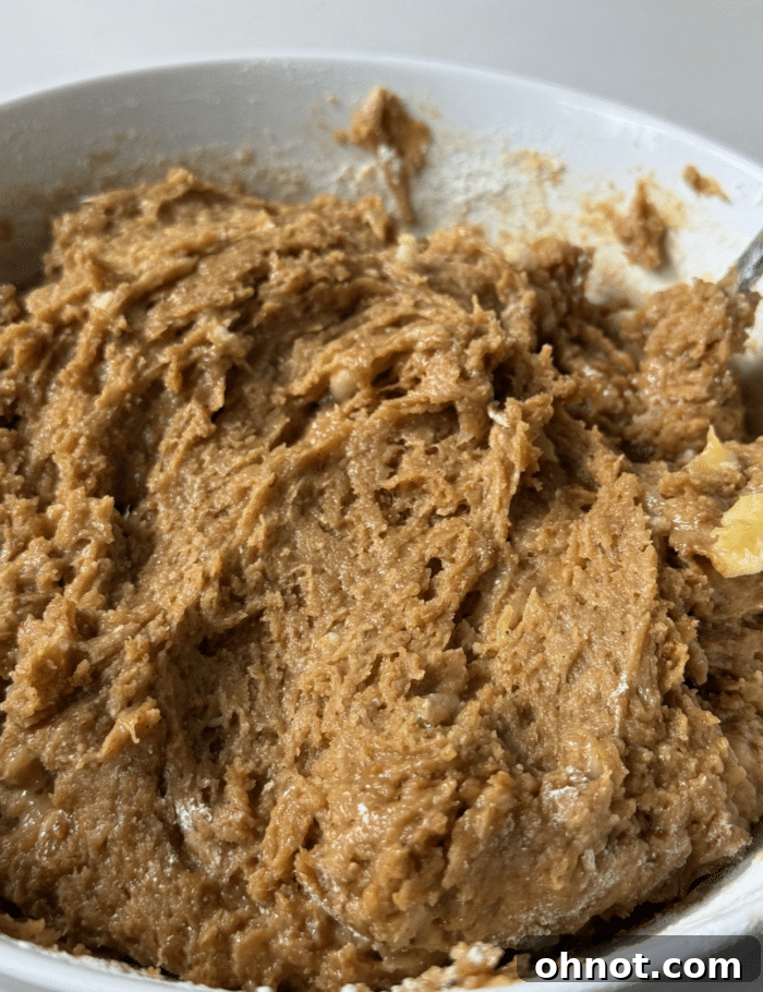 Smooth and rich peanut butter banana bread batter ready for the addition of chocolate chips.