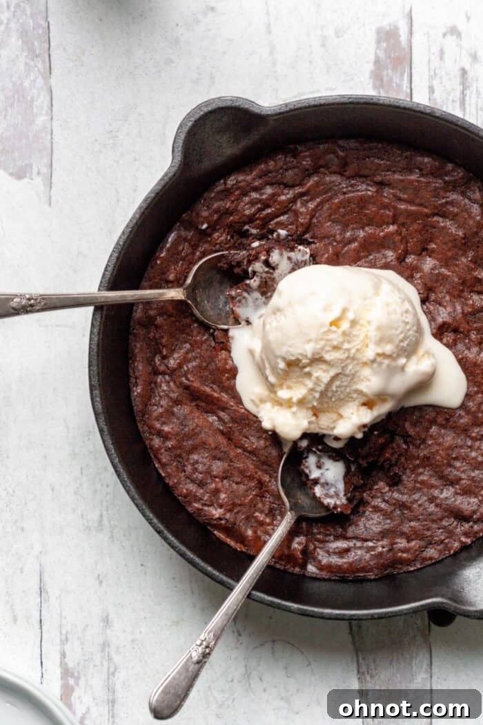 Decadent Paleo Brownie Skillet with a fudgy center and crispy edges.