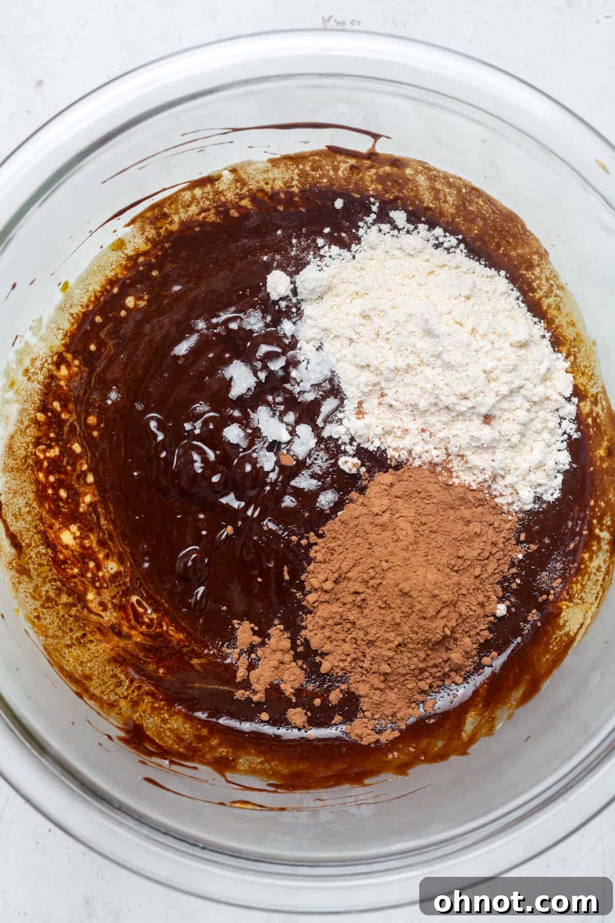 Cocoa powder and tapioca flour sifted into the chocolate batter.