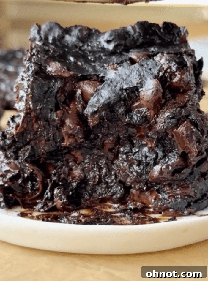 Bite of protein brownie showing the fudgy texture.