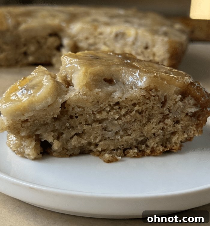 A stunning, freshly baked banana upside down cake, rich with caramelized bananas.
