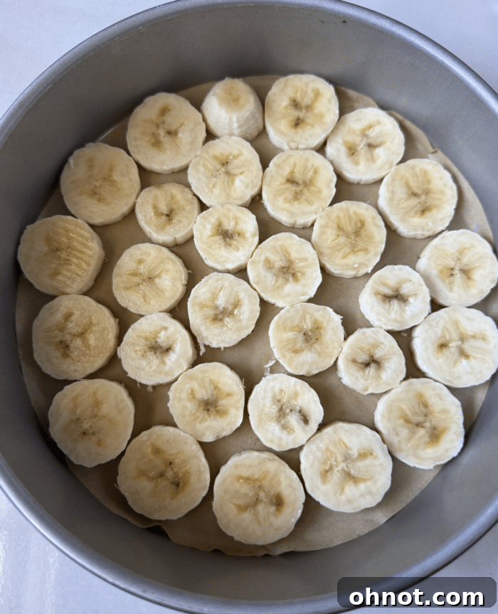 Perfectly sliced ripe bananas, ready for caramelization.