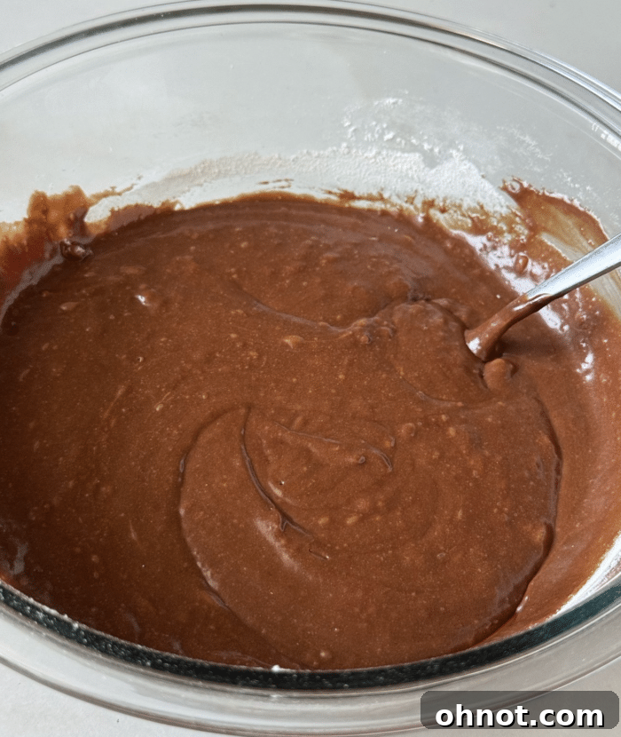 Brown batter in glass bowl.