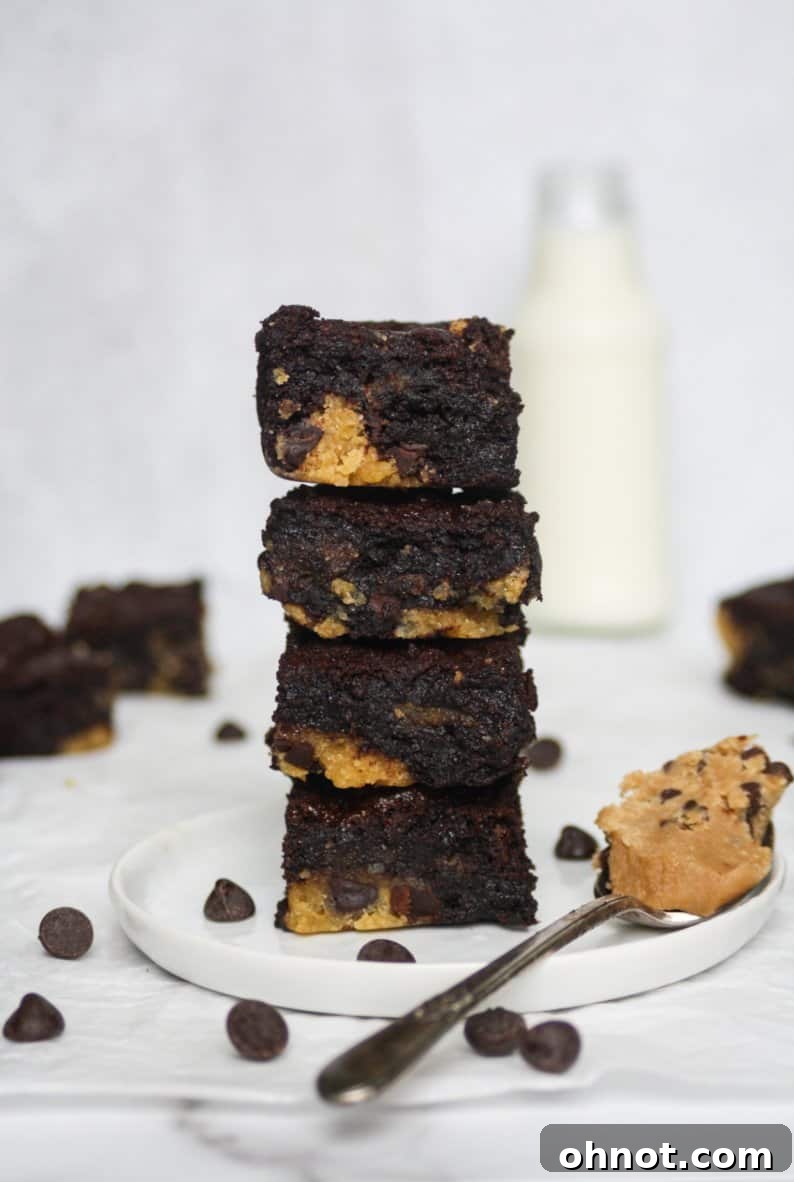 Delicious cookie dough stuffed brownies on a cooling rack, showcasing their fudgy texture and visible cookie dough swirls