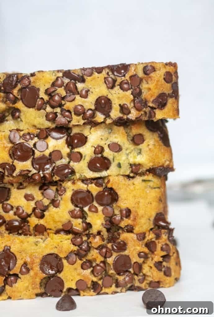 Stack of sliced zucchini bread pieces with chocolate chips