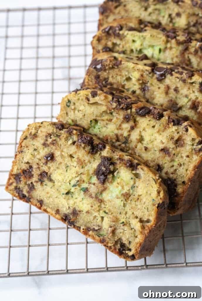 Zucchini chocolate chip bread slices on a board