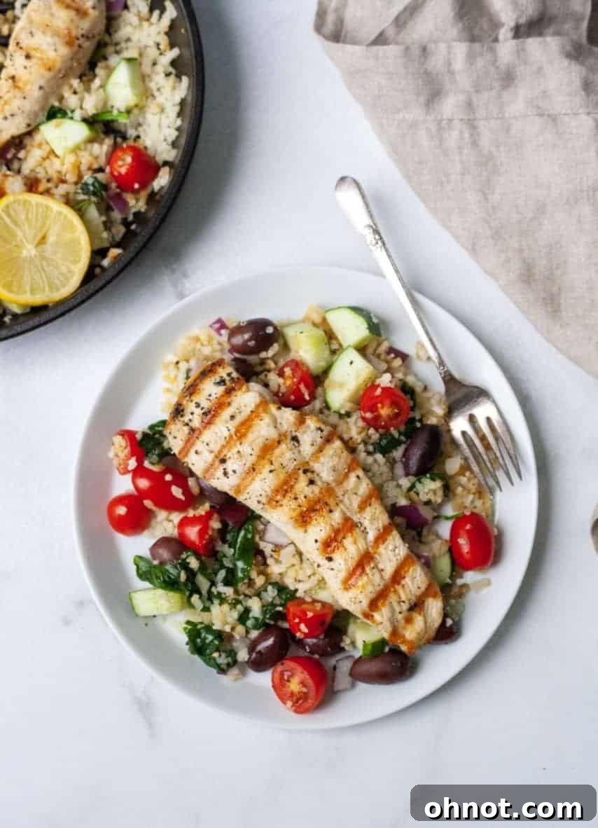 Searing chicken in a skillet for Greek chicken recipe