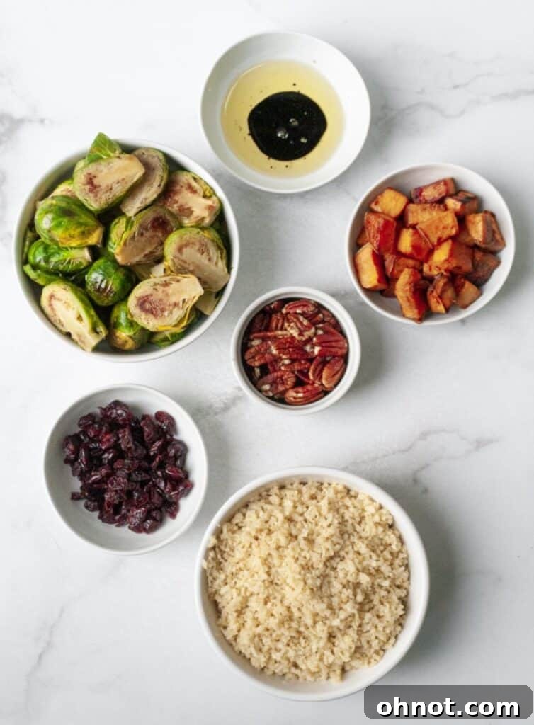 Fresh fall rice ingredients including Brussels sprouts, sweet potatoes, cauliflower, cranberries, and pecans on a wooden cutting board.