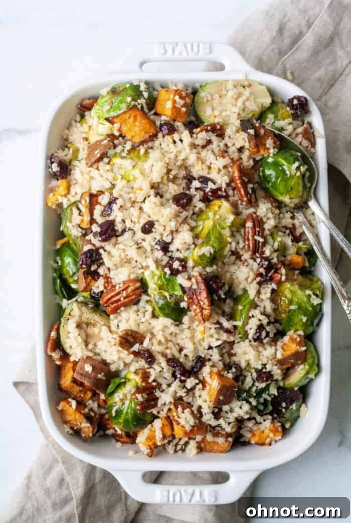 Cooked Whole30 cauliflower rice in a skillet, ready to be combined with other ingredients.
