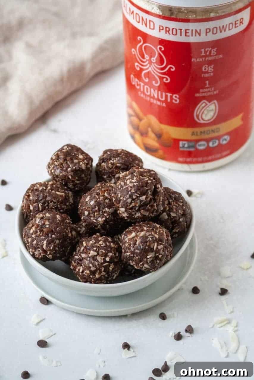 Finished Paleo Vegan Almond Joy Bites, perfectly coated in mini chocolate chips and ready to eat.