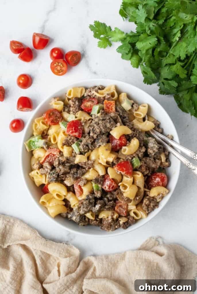 Hearty Paleo pasta salad displayed in an elegant white bowl, ready to be served