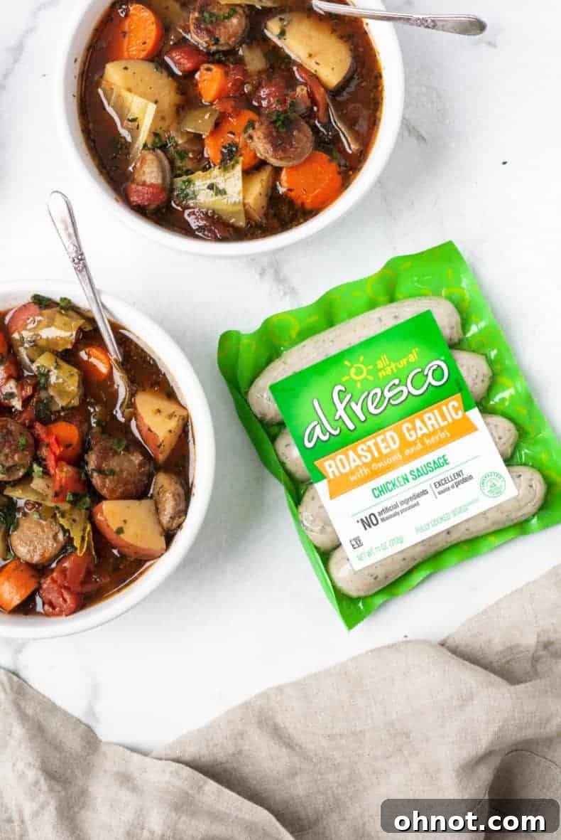A bowl of Paleo Sausage Cabbage Soup from an aerial perspective, showing its vibrant ingredients.