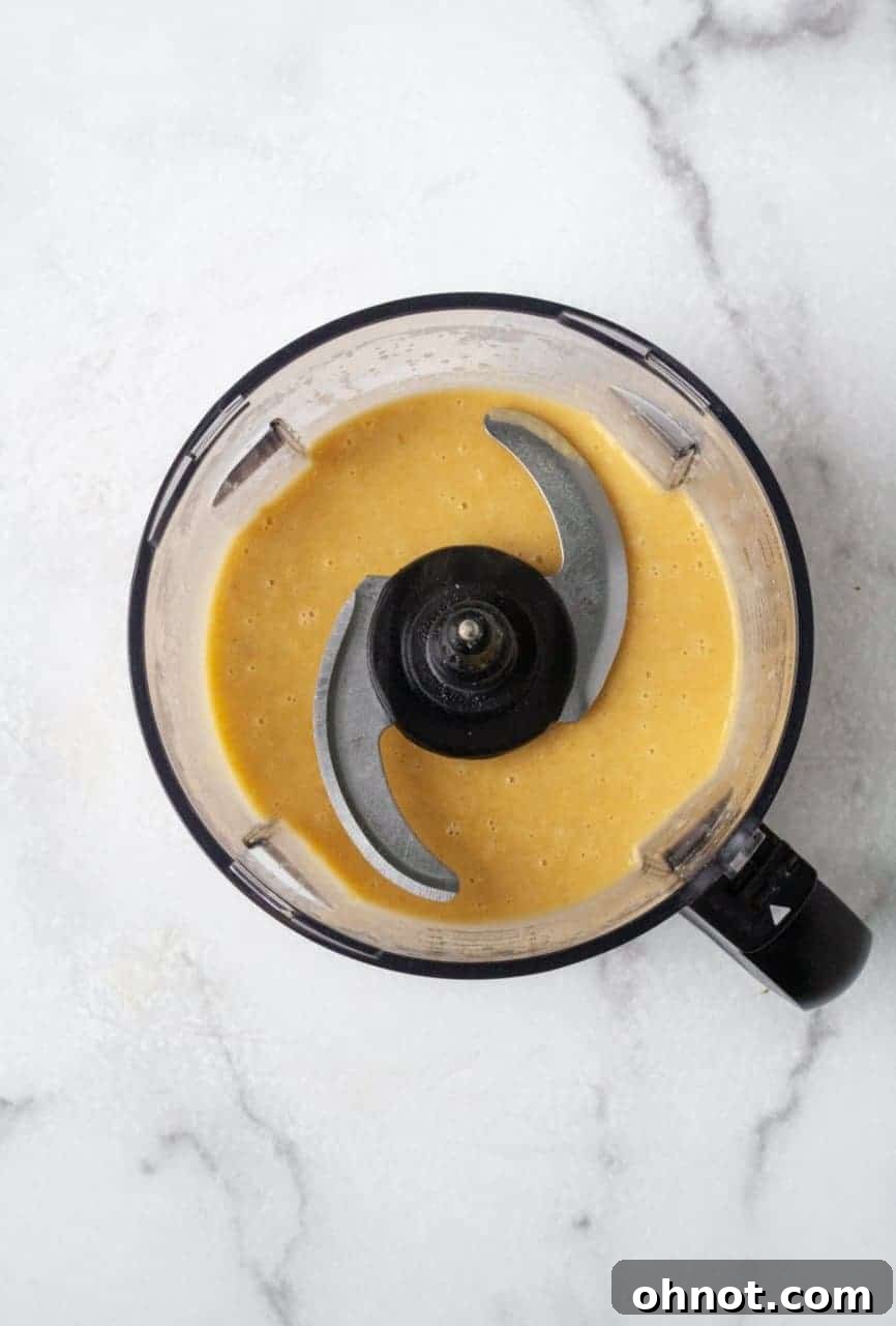 Close-up of the creamy butternut squash mac and cheese in a bowl, showing its rich texture.