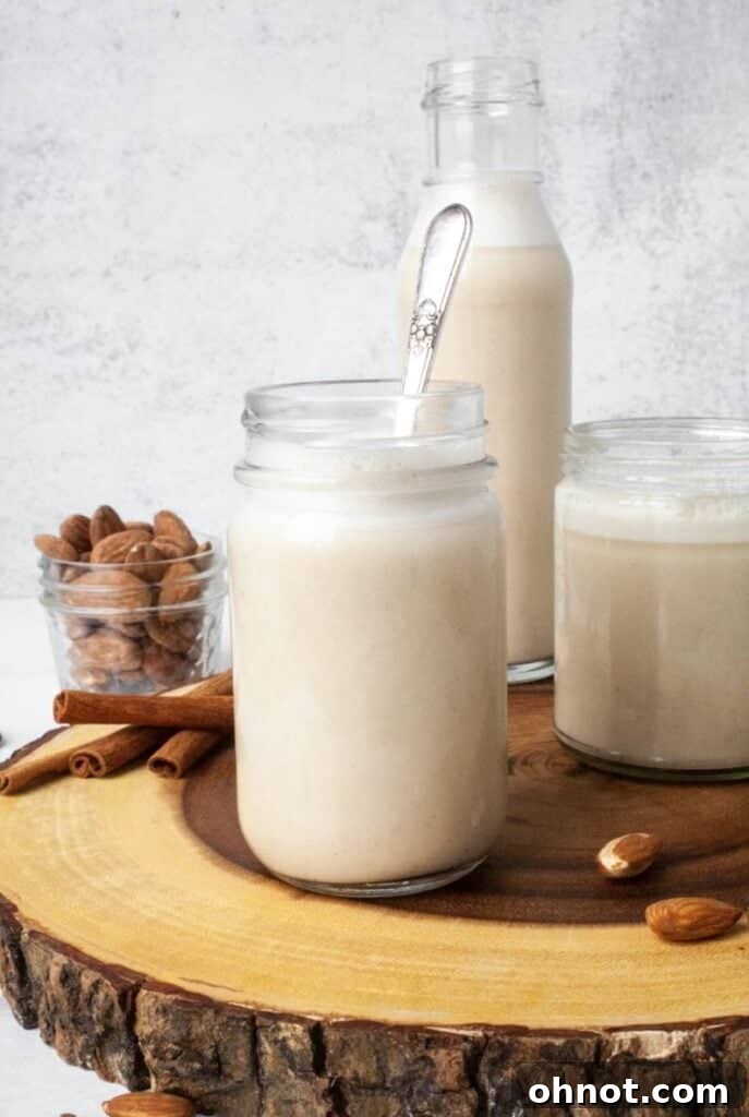 A tall glass of homemade Whole30 almond milk, showcasing its creamy texture.