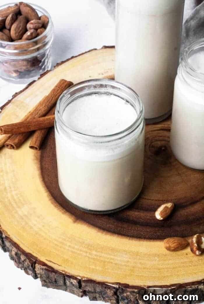 A glass jar filled with homemade almond milk, ready for use.