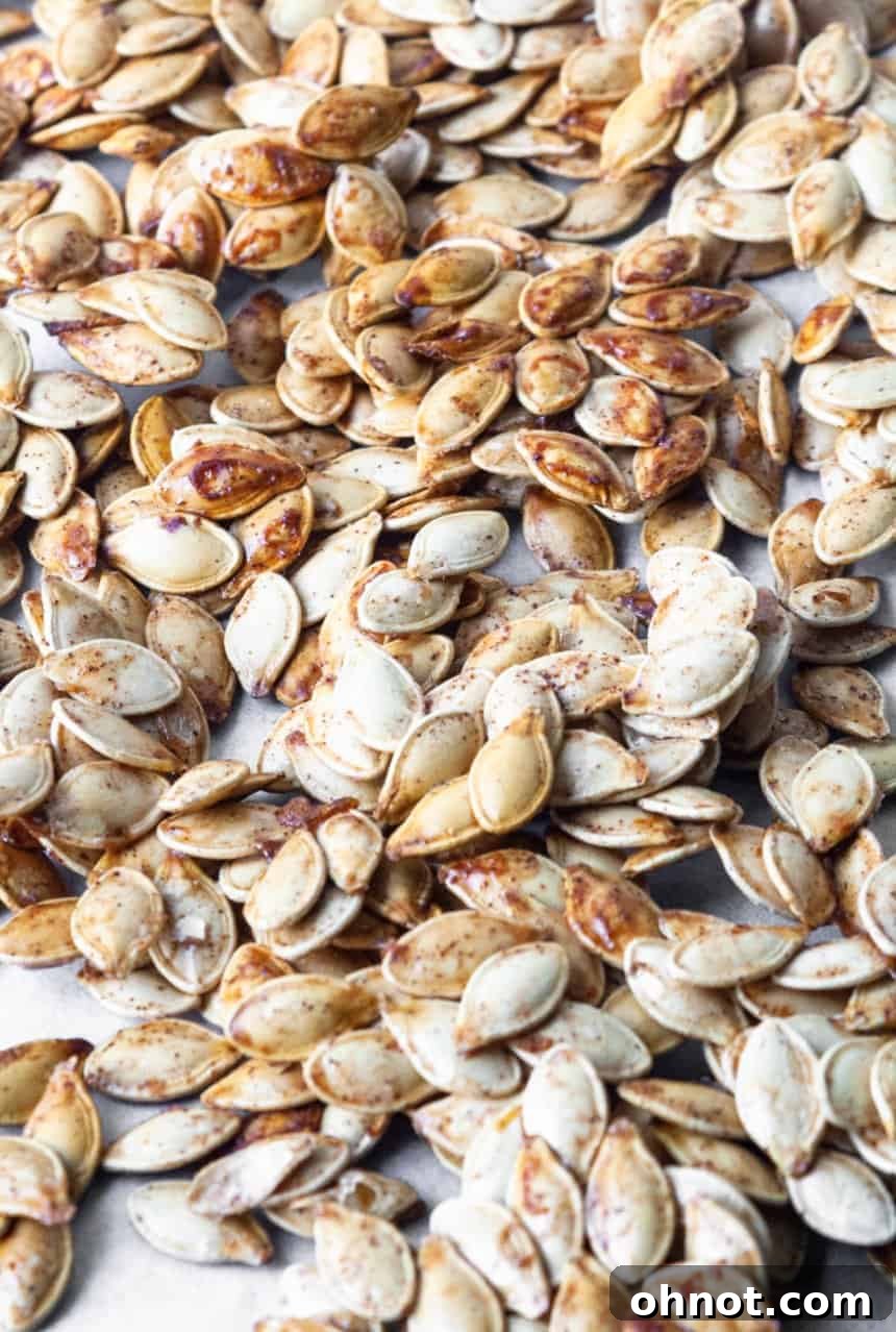 A bowl of freshly cleaned and dried pumpkin seeds, perfectly prepped for seasoning and roasting.