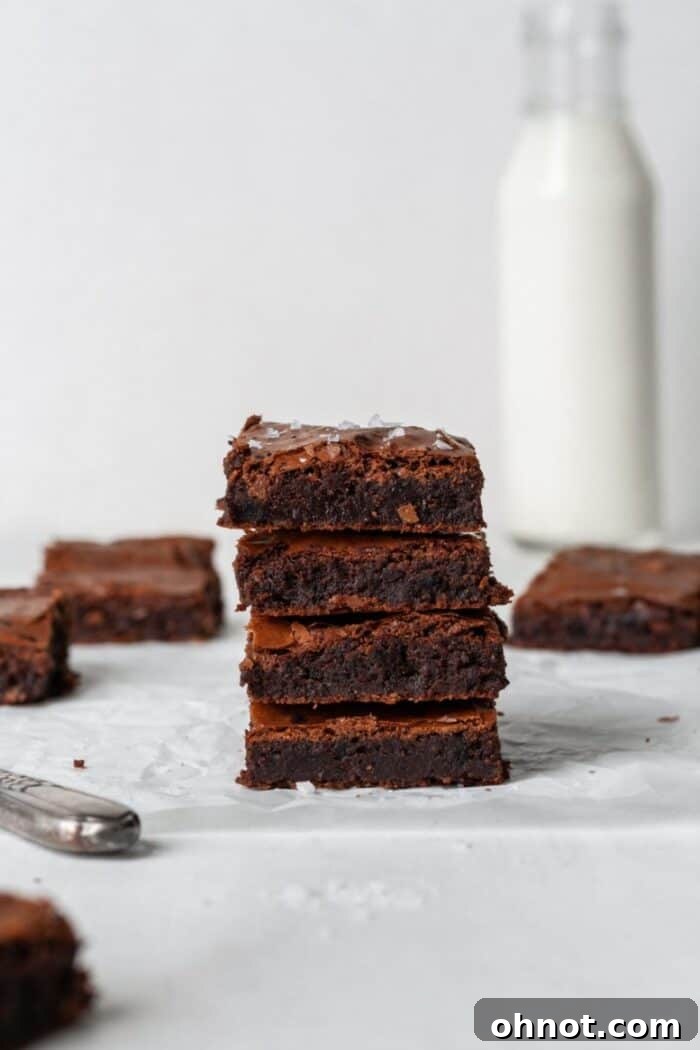 Grain-free brownies cooling on parchment paper, showcasing their perfect texture