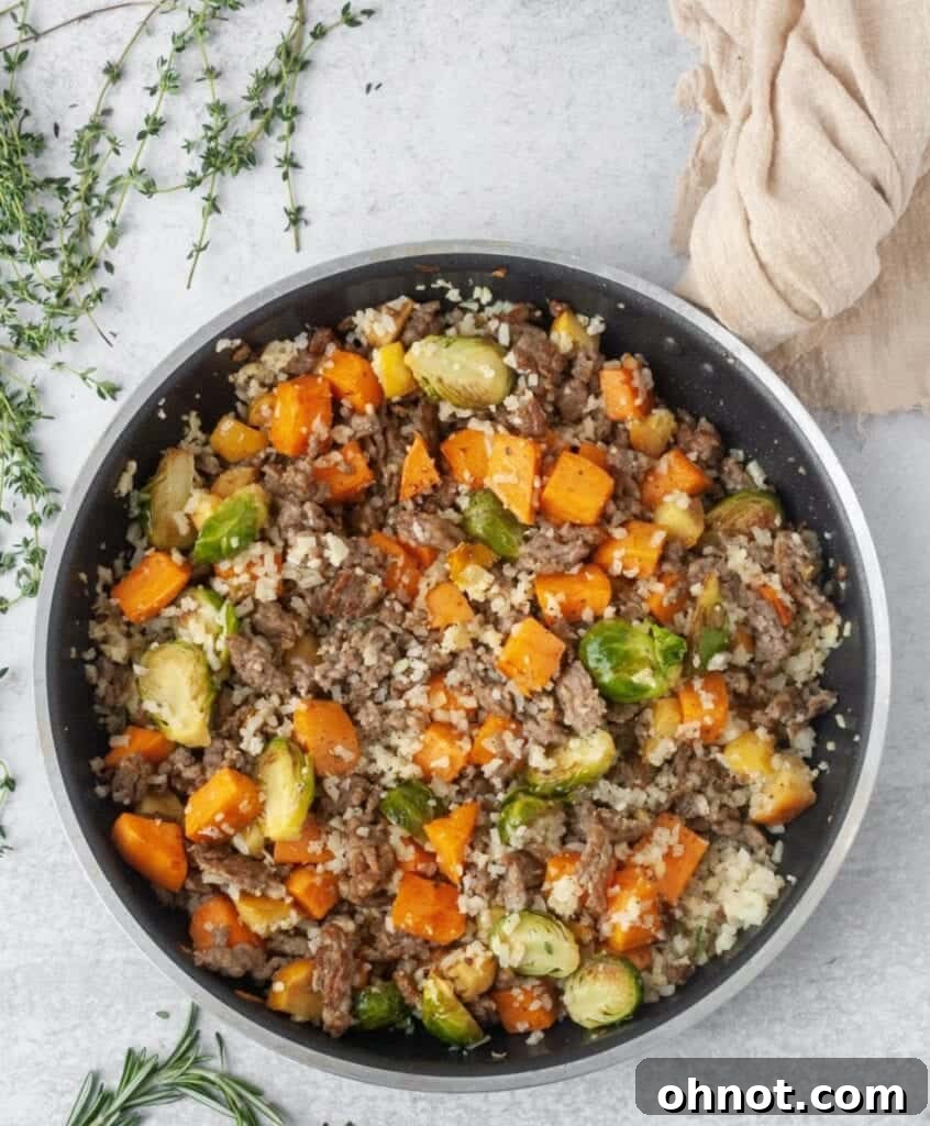 Delicious Whole30 Sausage and Veggie Stuffing in a skillet, ready to serve.