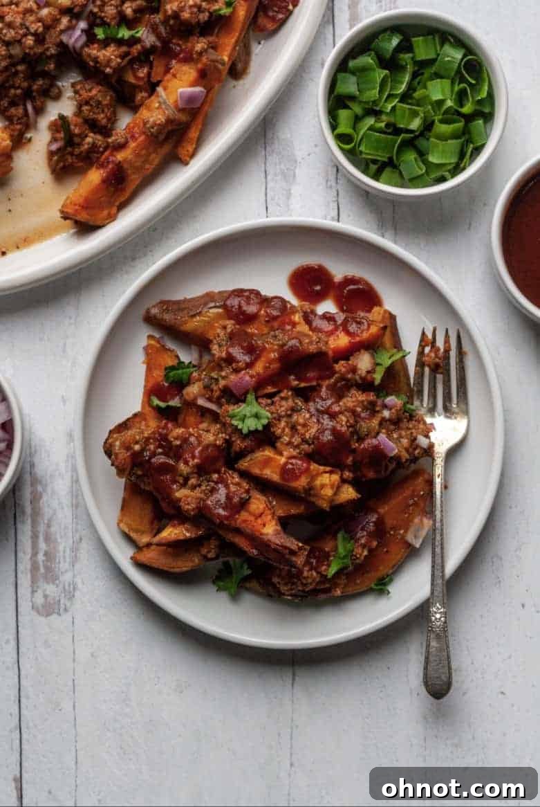 A full serving platter of Whole30 Chili Fries, showcasing the vibrant toppings and inviting presentation.