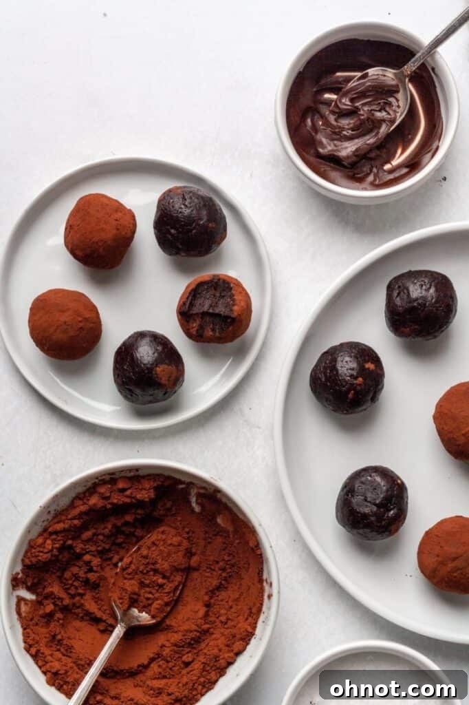 Vegan truffles lined up on a baking sheet.