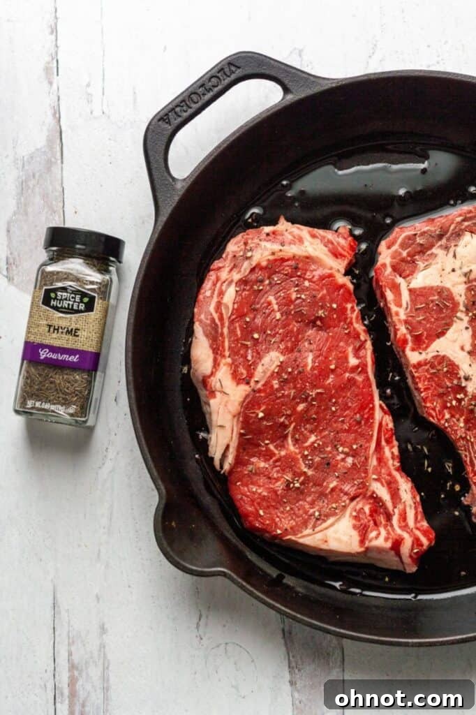 Searing Whole30 steak in a cast iron skillet to achieve a golden-brown crust