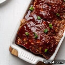 A Whole30 Paleo Asian Meatloaf in a white bread pan.