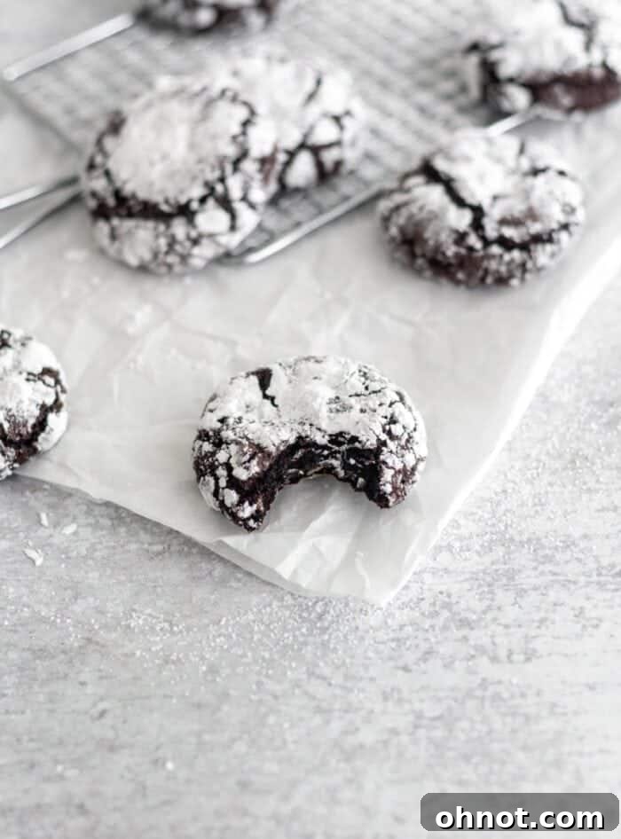 Gluten free chocolate crinkle cookie with a glass of milk.