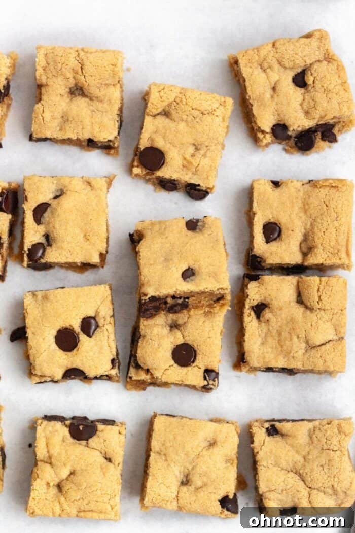Almond flour blondies on a white backdrop.