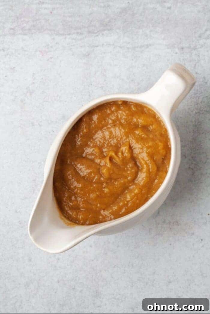 Homemade Whole30 Gravy in a white cup.