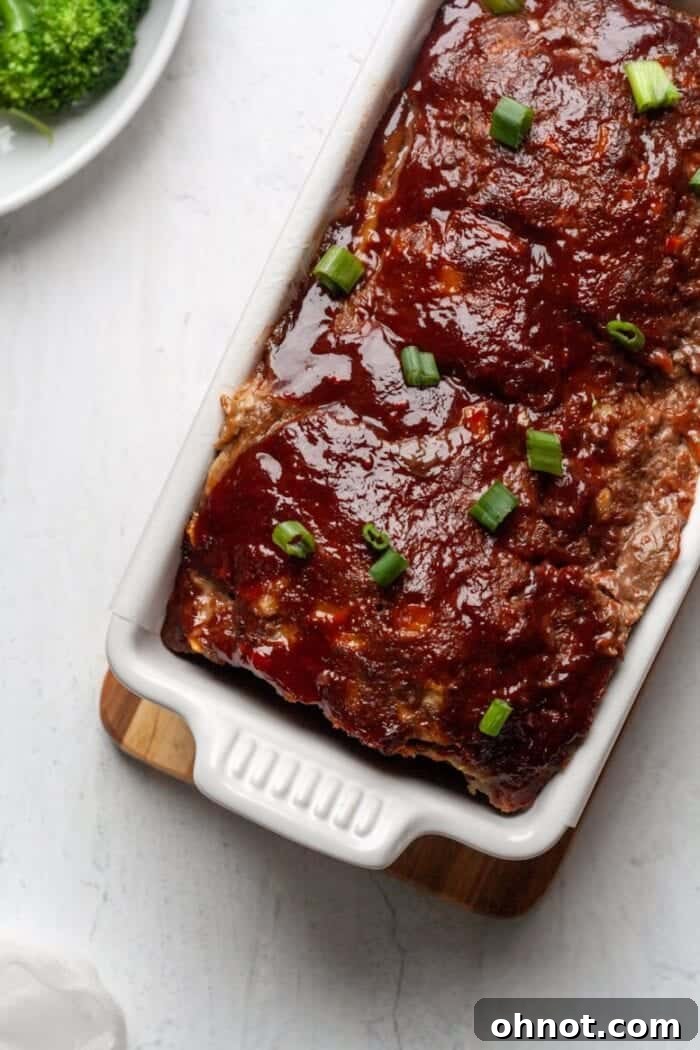 A Whole30 Paleo Asian Meatloaf in a white bread pan.