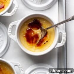 Paleo Crème Brulée in a white ramekin with a silver spoon.
