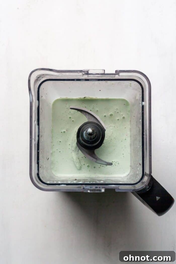 A blender with Mint Chocolate smoothie inside.