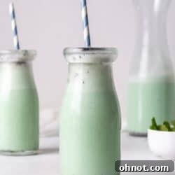 A glass jar filled with Dairy Free Mint chocolate smoothie.
