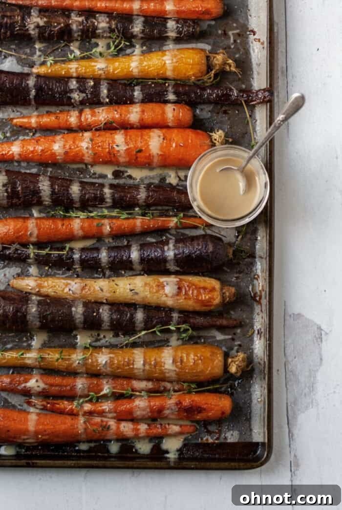 Air fried carrots on a baking sheet, golden and ready to serve.