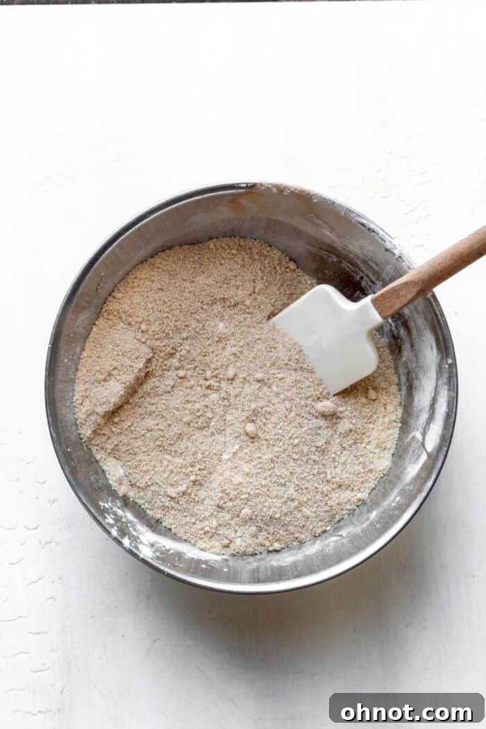 A mixing bowl containing all the dry ingredients for the banana cake.