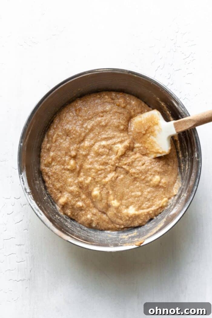 A mixing bowl with gluten free banana cake batter, showing its consistency.