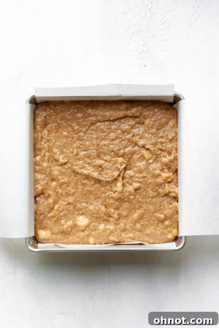 A baking pan filled with banana cake batter, ready for the oven.