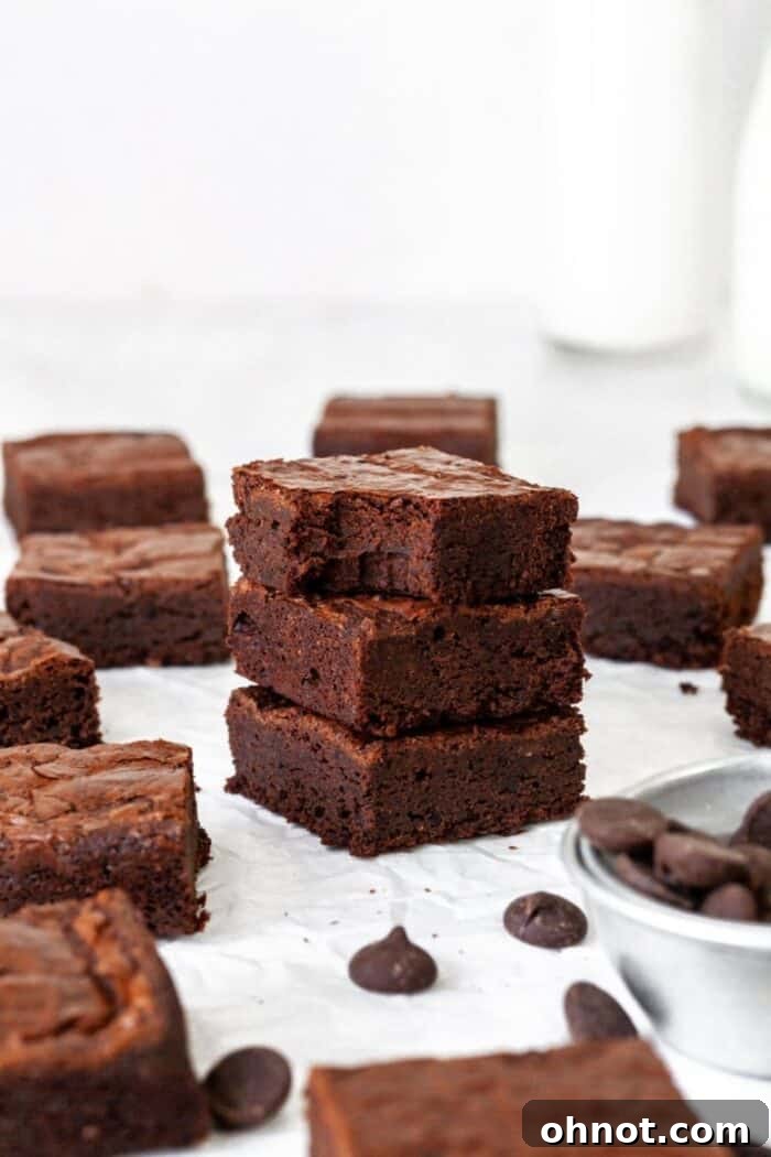 A beautifully presented stack of rich, dark cassava flour brownies