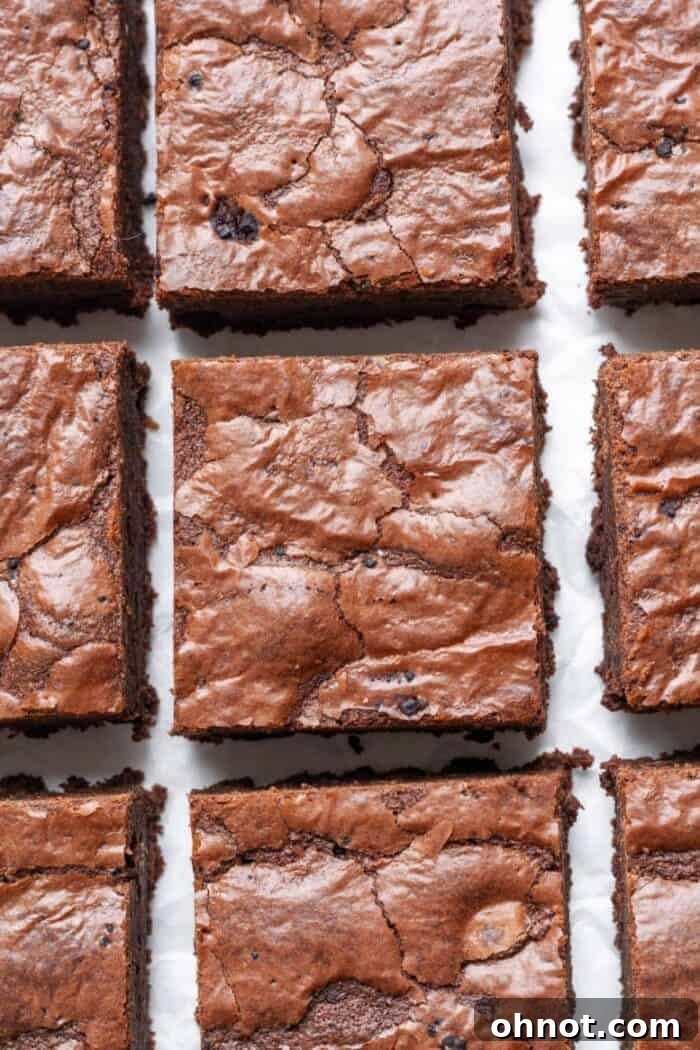 Rich, grain-free chocolate brownies cooling on parchment paper