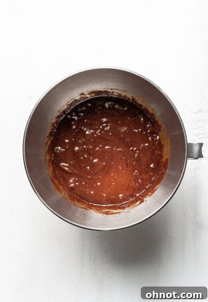 Smooth brownie batter blending in a KitchenAid stand mixer