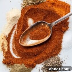 Gluten Free Cajun seasoning on a white plate with a spoon