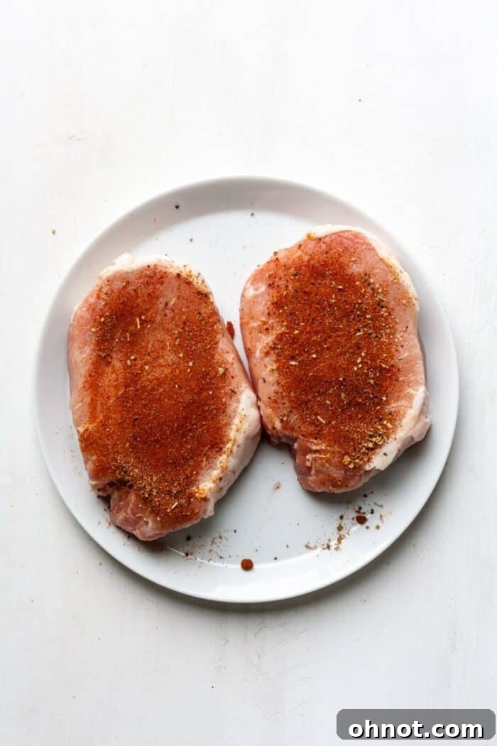 Seasoned pork chops on a white plate
