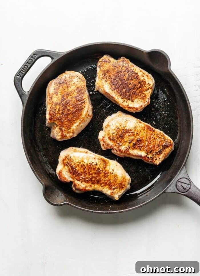 Pork chops in a cast iron skillet