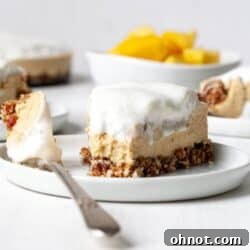 Vegan mango cheesecake on a white plate
