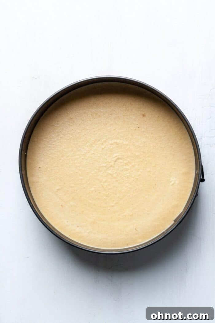 Healthy mango cheesecake setting in the freezer