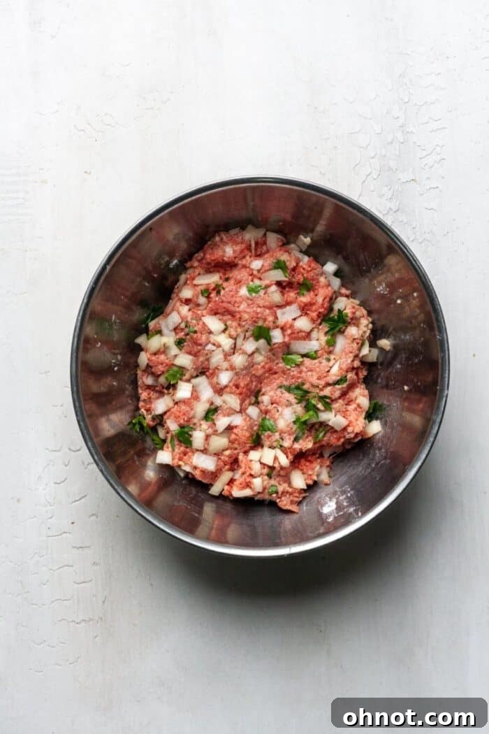 A bowl of egg-free meat mixture, ready to be formed into meatballs