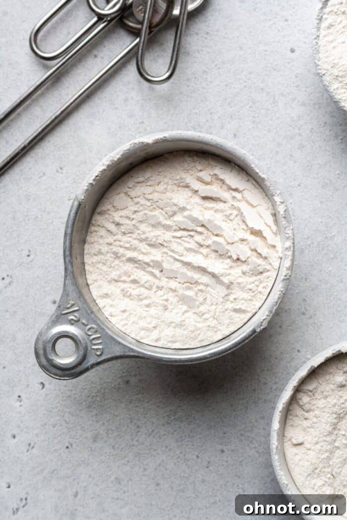 Cassava flour in a white cup, showcasing its fine, powdery texture
