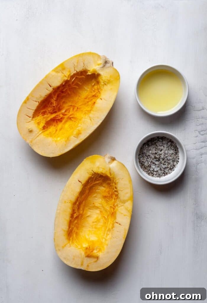 Raw spaghetti squash halves, olive oil, sea salt, and ground pepper as ingredients