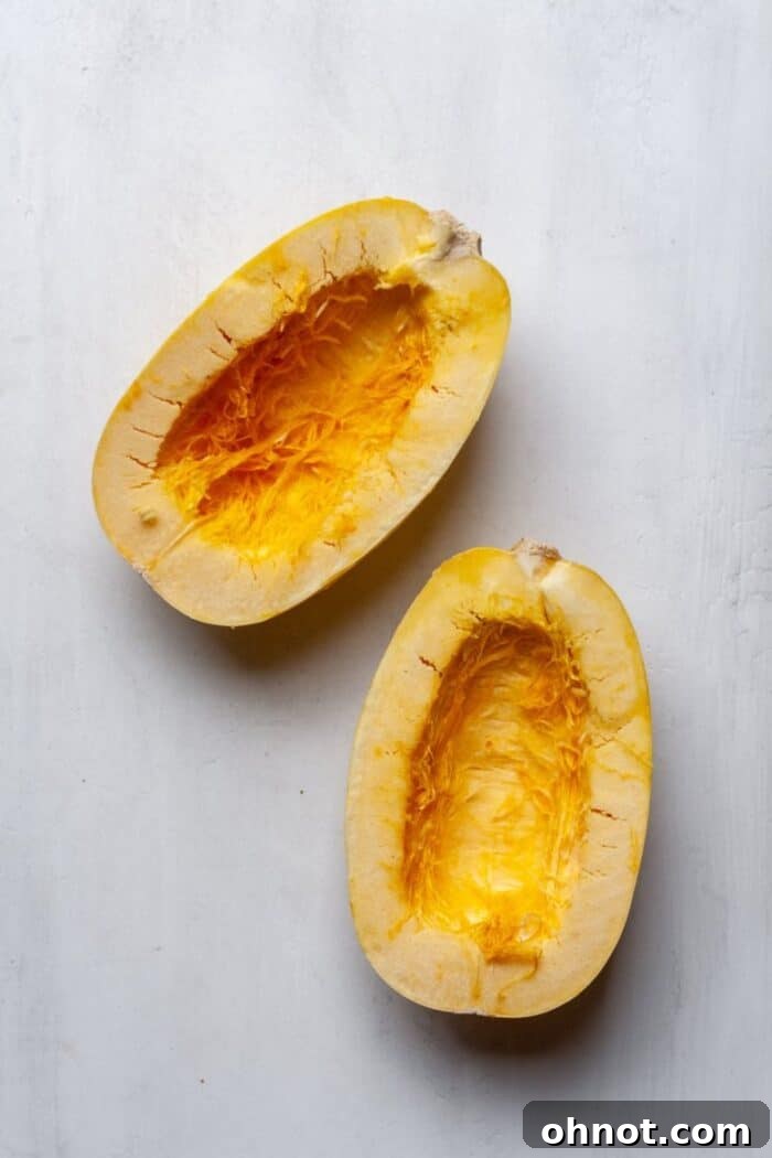 Spaghetti squash halves with seeds removed