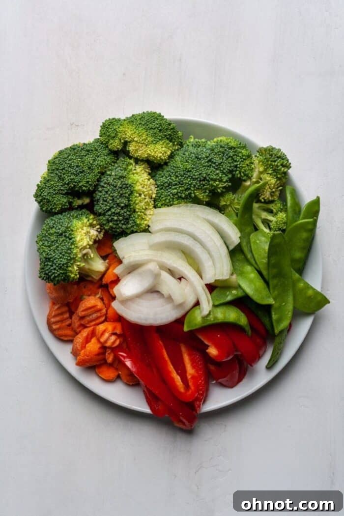 Fresh cut vegetables on white plate